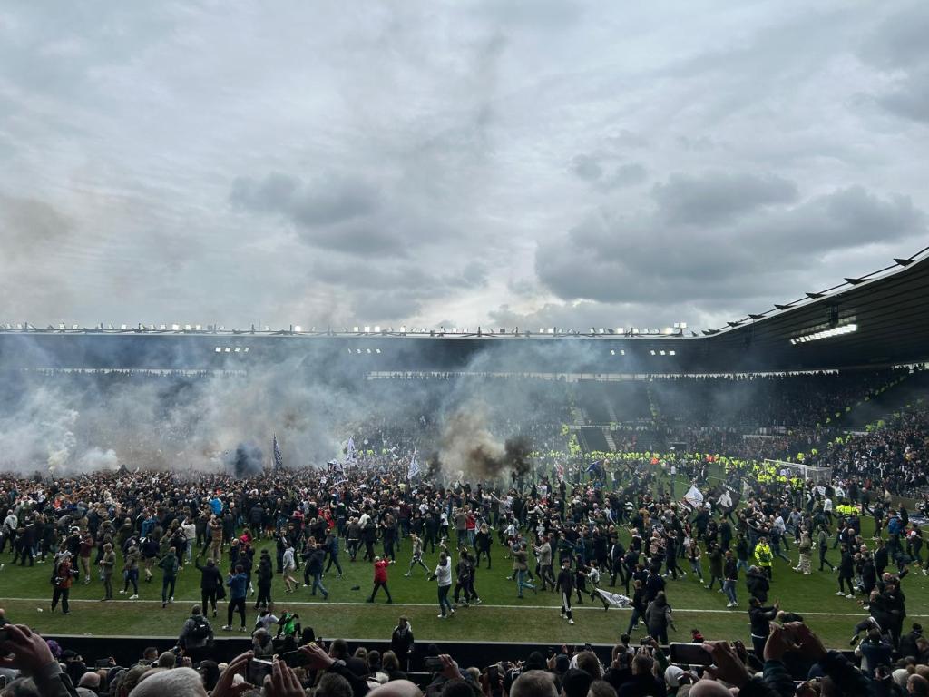 Derby fans pitch invading